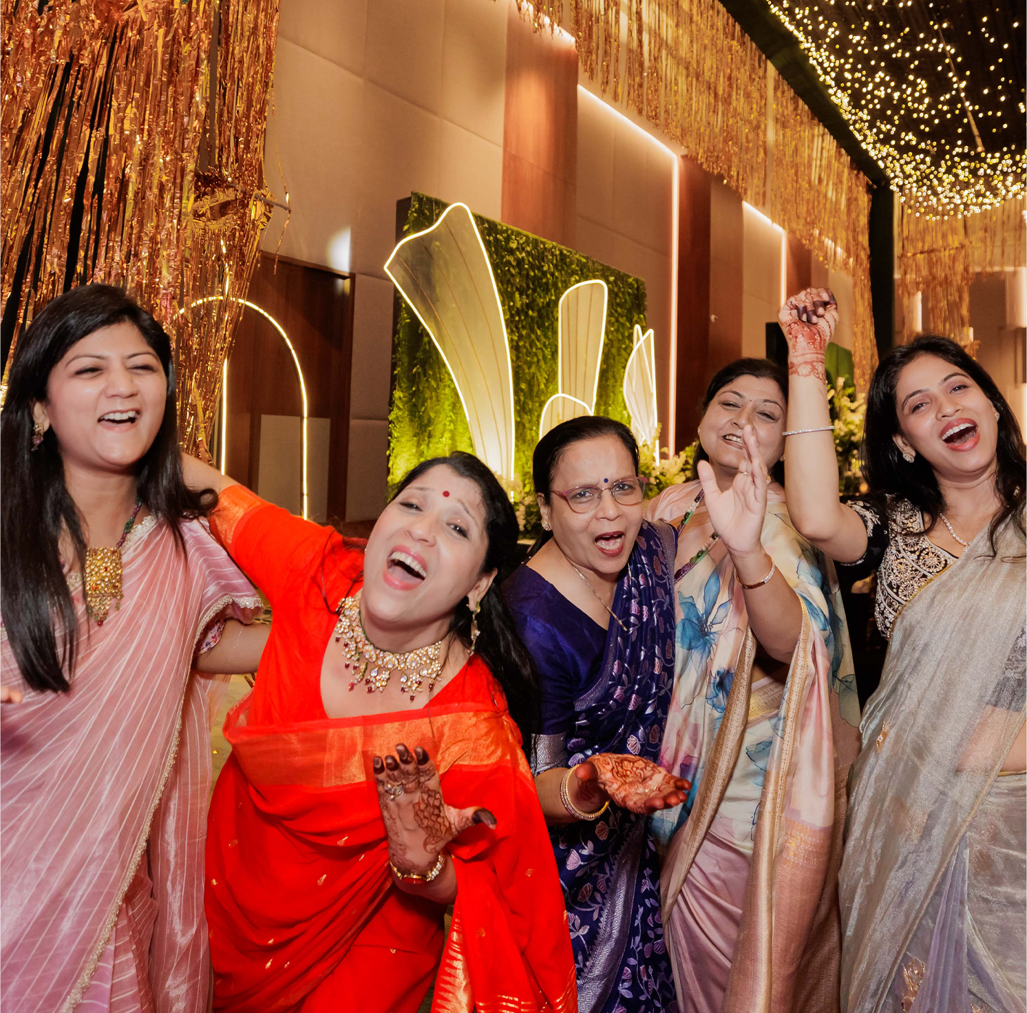 Joyful family celebrating together at a wedding